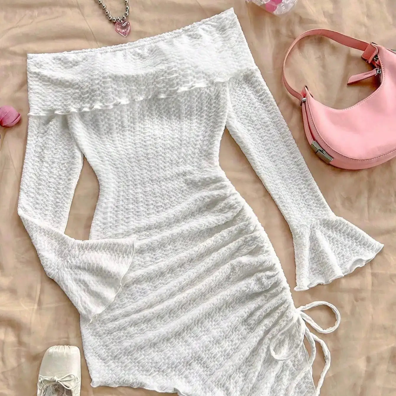 Spring and summer new pure horn long-sleeved hollow-out dress with irregular pleats wrapped buttock dress to show leg length