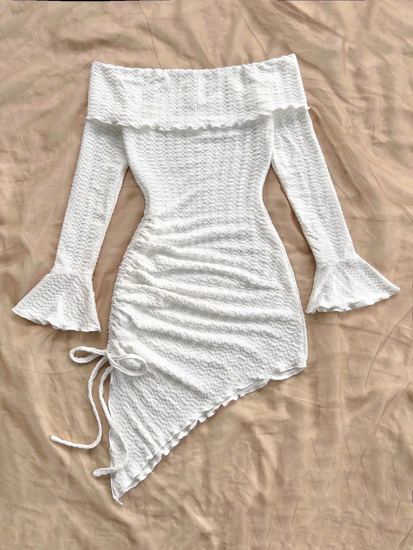 Spring and summer new pure horn long-sleeved hollow-out dress with irregular pleats wrapped buttock dress to show leg length